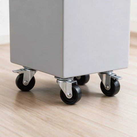Close-up of Four Pack Heavy Duty Flat Top Plate Caster Wheels with Poly Tires on a utility cart on a wooden floor.