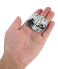 Hand holding iron folding hinge from 4 Piece Iron Folding Hinges With Concealed Mounting, Dual Shaft Design, And Preset Stop Points