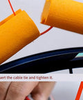 Installing orange tubeless tire inserts for 700c, 27.5 and 29 road bikes, air insert liner foam for rim protection.