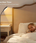 Modern Black LED Floor Lamp That Shines Brighter For Cozy Living Room Ambiance beside sleeping child in bedroom