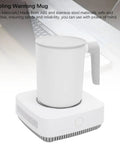 Next Level Smart Mug Warmer And Portable Beverage Cooler With Intelligent Temperature Control keeps drinks hot or cold, grey ceramic mug, desktop use.