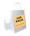 White Gift Bags With Handles 100 Pack 8.25x4.3x10.6 Inch Bulk Kraft Paper Bags with stack of bags, visible label.
