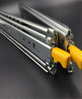 Heavy Duty Full Extension Drawer Slides With Double Row Steel Ball Bearings Built Tough For Daily Use Rock Solid Gliding Performance For Everyday Home Projects 72 Inch Three Fold Rail System supporting 400 lbs with yellow locking handles.