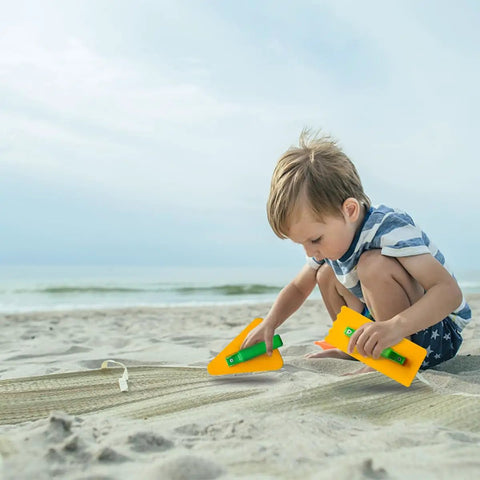 Child playing with 7 Piece Beach Sand Toys Set With Buckets Shovels Rakes And Castle Sand Molds For Kids Bright And Kid Friendly Beach Accessories