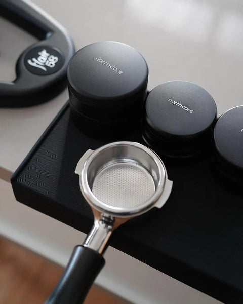 58mm Coffee Distribution Tool For Espresso Portafilter Leveler With Adjustable Depth And Stainless Steel Base shown on table
