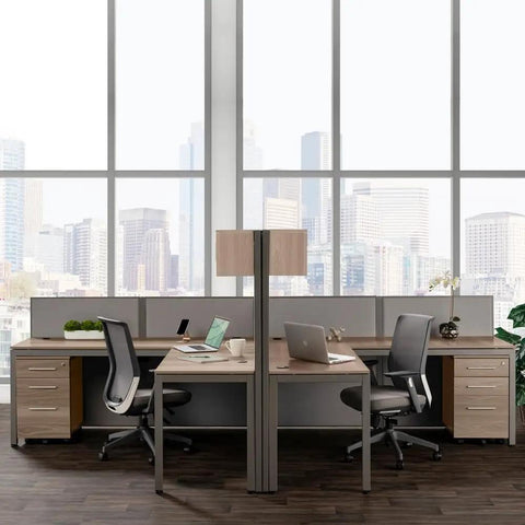 Dual L Shaped Office Cubicle Workstation With Roll Along File Cabinet And Chill Gray Desktop Layout For Squad Collaboration and hassle free daily workflow management, featuring two desks and large windows.