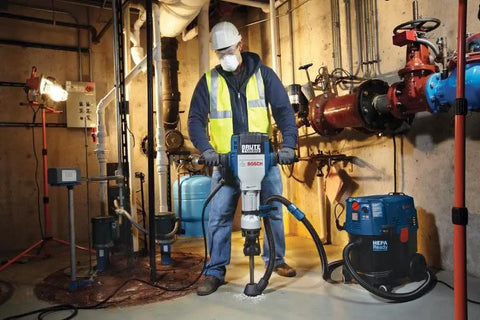 Worker using Beefy 20 Inch Narrow Chisel For 1-1/8 Inch Hex Breaker Hammers in industrial setting