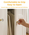 Hand gripping crystal cabinet knob from Crystal Cabinet Knobs 30mm Diamond Drawer Pulls Set Of 26 With Gold Base 1-1/4 Inch Diameter 3/4 Inch Base Screws Included Easy Install For Cabinets And Drawers Adds Dope Modern Vibe To Kitchen And Furniture.