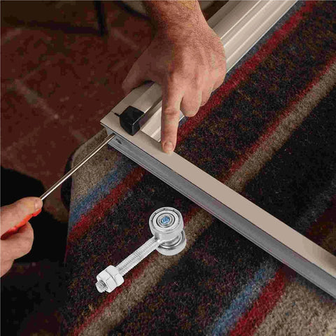 Beefy Heavy Duty Sliding Door Roller Trolley Assembly With Two Bearings And Dual Wheels, close-up being installed on track