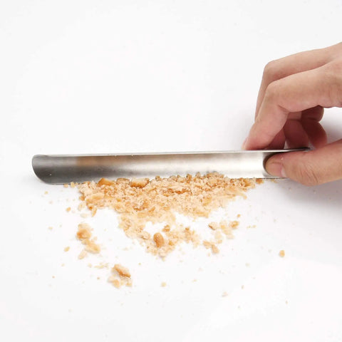 Person using Stainless Steel Crumb Sweeper For Waitstaff And Home Use Pro Grade Table Scraper For Crumbs On Counters And Tablecloths Perfect Server Tool