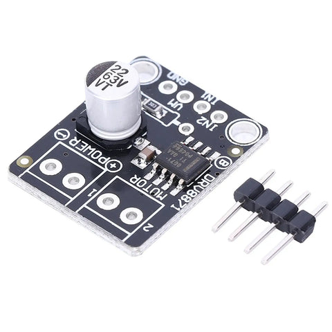 Close-up of a 3.6A DC PWM Motor Driver Module with H Bridge for small machines showing 4-wire interface and dual guard pin headers.
