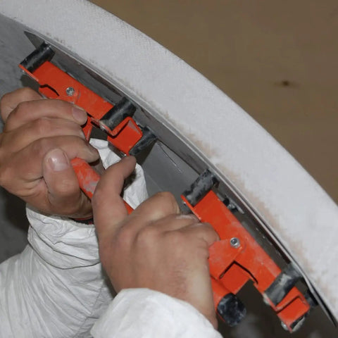 Hands using Flexible Sanding Block Flexisander for curved surfaces with a sturdy fastening system, ideal for auto body repair.