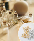 Must Have Gold And Silver Screw Eye Pins Set For DIY Jewelry Making And Craft Projects, shown with glass bottles and eyelet pins.