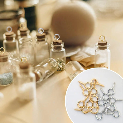 Must Have Gold And Silver Screw Eye Pins Set For DIY Jewelry Making And Craft Projects, shown with glass bottles and eyelet pins.