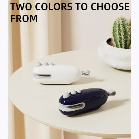 Two colors of 2 In 1 USB Rechargeable Heat Sealer With Cutter For Plastic Bags on a table, white and blue options displayed next to a cactus.