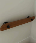 Heavy Duty Wall Mount Stair Railing Handrail Kit For Modern Lofts And Homes Durable Stainless Steel Safety Rail Built Like A Tank Handling Four Hundred Pounds With Clean Smooth Indoor Outdoor Look mounted on a wall with black brackets and wooden grip.
