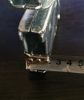 Close-up of Multifunctional Folding Ladder Hinge Set showing steel material and measuring tape for size reference, stable load bearing