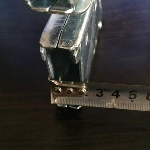 Close-up of Multifunctional Folding Ladder Hinge Set showing steel material and measuring tape for size reference, stable load bearing