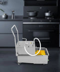 Top Tier 550W Commercial Fryer Oil Filter Machine Hella Efficient Design Kicks Heavy Grease Buildup Swiftly Badass Performance For Bustling Restaurants Portable Stainless Steel Deep Fry Strainer Cart, side view in kitchen.