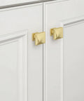 5 Pack Brushed Gold Cabinet Knobs Made From Solid Zinc Alloy on white cabinets, showcasing premium kitchen hardware design.