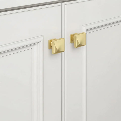 5 Pack Brushed Gold Cabinet Knobs Made From Solid Zinc Alloy on white cabinets, showcasing premium kitchen hardware design.
