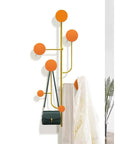 Hella Sturdy Wall Mount Coat Rack With Creative Cloak Hooks For Entryway Organization decorative coat rack with orange hooks and handbag.