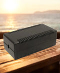 Get These Rad 2pc Black Plastic Junction Boxes For Your Dope Electronic Projects. Sturdy ABS enclosure on a wooden surface.
