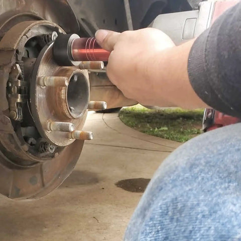 Wheel Stud Installer Tool Replacement 22800 For Most Light-Duty Trucks And Cars in use on vehicle hub