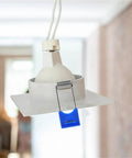 Lawsen Spring Clips Recessed Lighting 100 Pcs Spring Snap Downlight Clips attached to a ceiling mounted LED lamp holder.