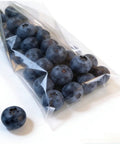 Compact Horizontal Flow Wrapper Shrink Wrap Machine 50 To 80 Pieces Per Minute Smooth Operator For Retail Stores And Home Packaging Hustle Reliable Sealing No Sweat Setup For Modern Entrepreneurs with packaged blueberries.