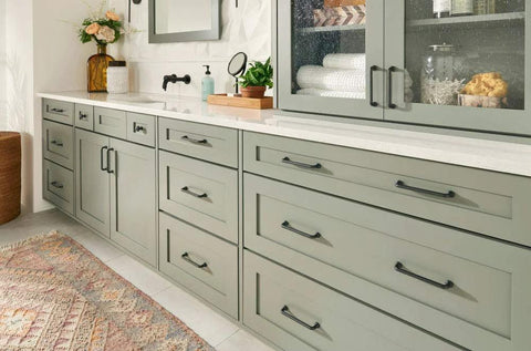 Malin Collection Cabinet Pulls in Warm Brass Finish on kitchen cabinets, 5 1/16 inch mounting centers, overall length 5 3/4 inches.