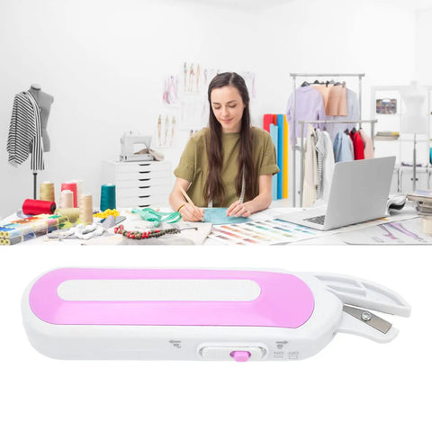 Top Shelf Electric Mini Scissors For Sewing And Crafting Cordless Portable Shears With Ergonomic Handle and Dual Power Setup on desk.