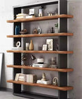 Rock Solid Industrial Bookshelf With Thick Solid Wood Shelves Five Tier Floor Standing Unit For Living Room Or Office Heavy Duty Metal Frame Storage Rack Top Shelf For Books Plants And Decor Zero Hassle Setup, displaying books and decor on wooden shelves.