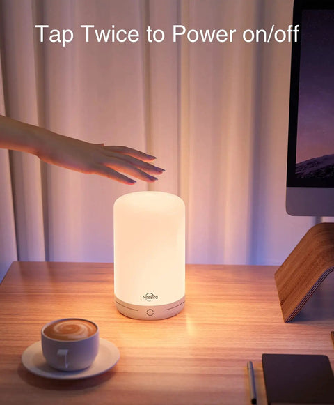 Hand reaching to turn on Smart LED Bedside Lamp With App Control, Voice Assist, and RGB Color Changing Mood Light on desk