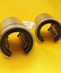 Open Linear Motion Bushing Bearing 12x21x30mm Two-Pack LM12UU-OP with rugged steel housing on yellow background