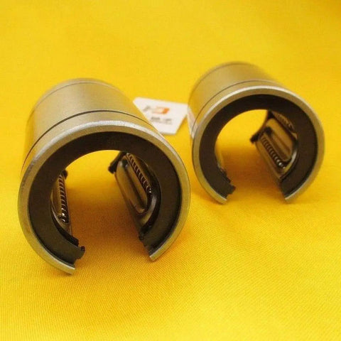 Open Linear Motion Bushing Bearing 12x21x30mm Two-Pack LM12UU-OP with rugged steel housing on yellow background