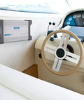 Beefy 1500W Peak 4 Channel Marine Amplifier Receiver with IP65 Waterproof installed on a boat dashboard