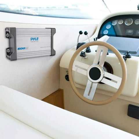 Beefy 1500W Peak 4 Channel Marine Amplifier Receiver with IP65 Waterproof installed on a boat dashboard