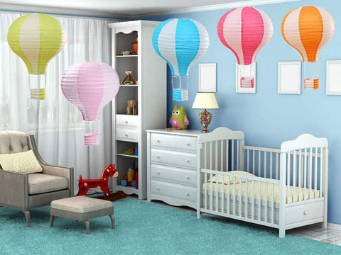 12 Inch Hanging Hot Air Balloon Paper Lanterns Set Of 6 For Birthday Parties Weddings Christmas Decor Gift Stripe Design Colorful And Cute Romantic Hanging Decorations For The Party Vibe displayed in a nursery room.
