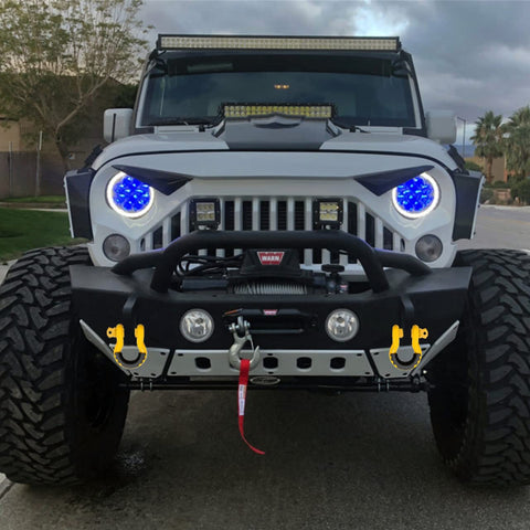Jeep with Beefed-Up Heavy Duty Three Quarters Inch D Ring Shackles Set Forged Steel Tow And Winch Shackles Four Point Seven Five Ton Load Capacity Two Pack Off Road Recovery Gear Yellow Powder Coat With Isolators attached to front bumper.