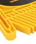 Close-up of adjustable featherboard for table saws, yellow ABS construction, detailing grooves and clamps for precision safety.