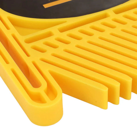 Close-up of adjustable featherboard for table saws, yellow ABS construction, detailing grooves and clamps for precision safety.