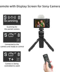 Vlogging Hand Grip Tripod With OLED Rechargeable Wireless Cam Remote beside Sony camera, demonstrating zoom control