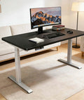ProMove Electric Height Adjustable Desk With Instant Memory Buttons And Slick AntiCollision Shield For Dope Gaming Rigs and Chill Home Office Workstations In RealWorld Dimensions, black tabletop and silver legs.