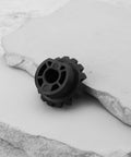 Black plastic bevel gear for table saws, replacement part 2610015042, durable, high wear resistance, black background