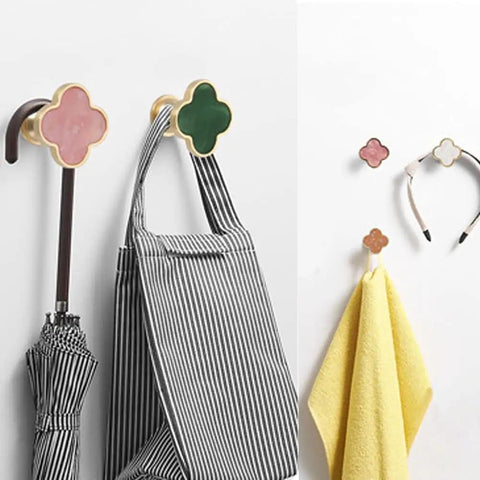 Sweet Looking Pink Clover Drawer Knobs Six Pack For Dressers And Kitchen Cupboards on hooks with umbrella and towels.
