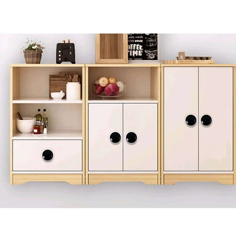 Hella Stylish Yellow Ceramic Knobs And Round Drawer Pulls For Kitchen Cabinets And Dressers Featuring Heavy Duty Zinc Alloy Backing Kid Friendly Curved Shape Tough As Nails Scratch Resistant Finish Make Your Home Decor Pop Set Of Four showcased on a modern cabinet with black round knobs.