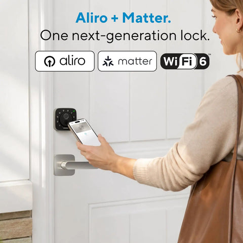 Person using smartphone to unlock Aliro next-generation WiFi smart lock on a door handle.