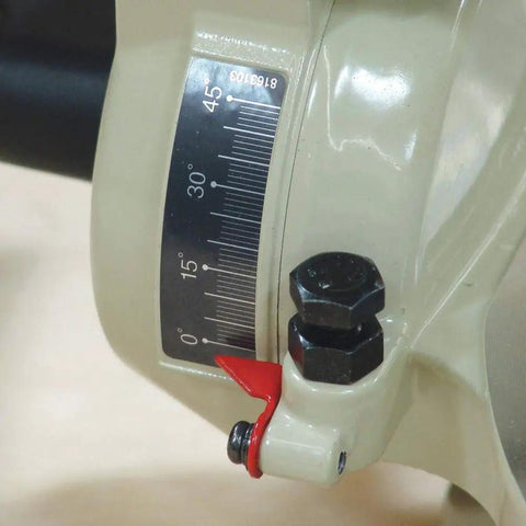 Close-up of angle adjustment dial on 10 Inch 15 Amp Compound Miter Saw With Beefy 4600 RPM Motor for precise cuts.