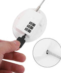 Close-up of Kid Proof Fridge And Cabinet Lock With Password Protection, White Plastic Babyproof Lock with cable and key insertion